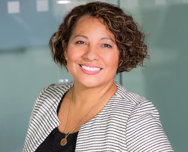 woman wearing gray stripe jacket