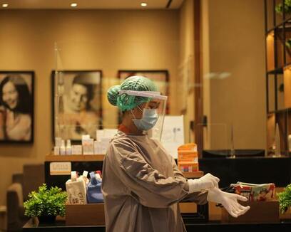 woman wearing PPE kit